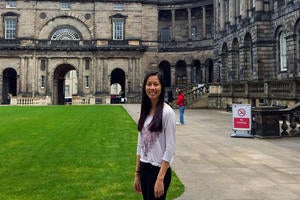 UCR student standing in front of University of Edinburgh