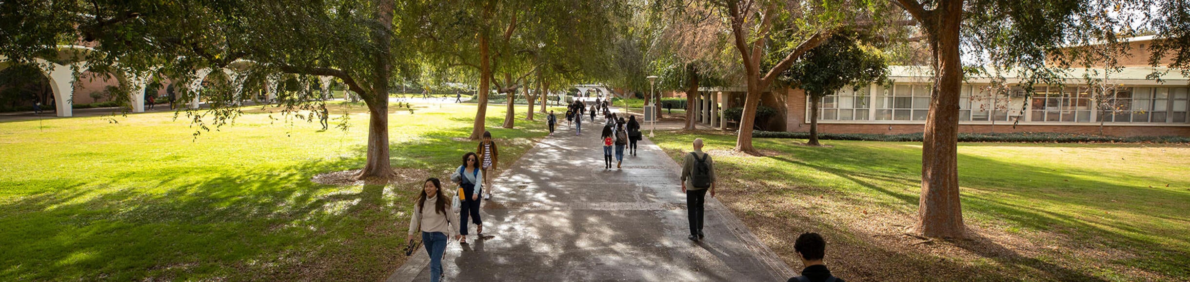 Students walk the campus between Rivera Library, left, and Watkins Hall on January 17, 2020. 