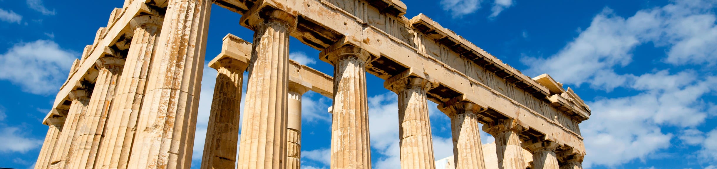 Low angle photo of the Parthenon during the day time